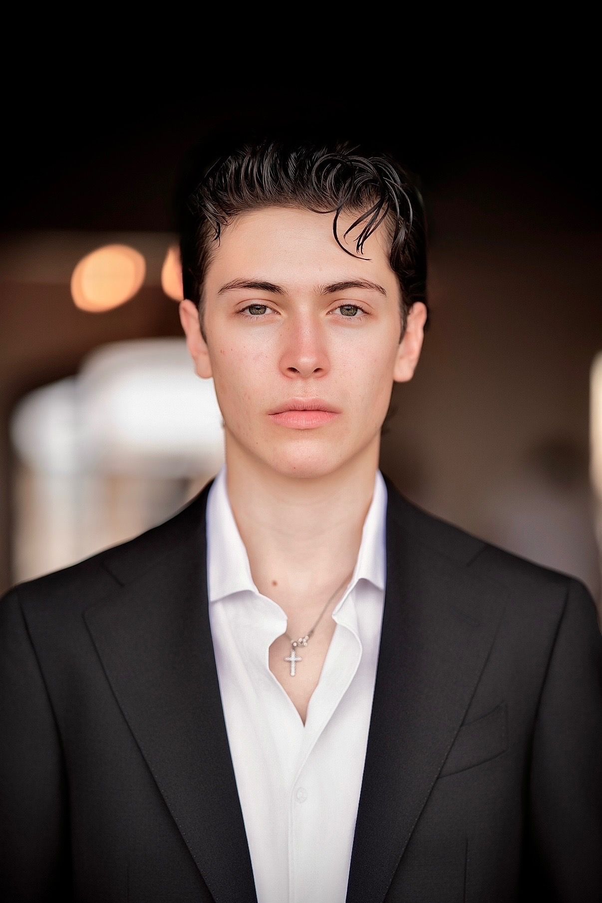 Santiago Carbone in a dark suit and white shirt, looking at the camera